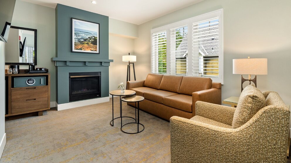 a living room with a couch and a fireplace